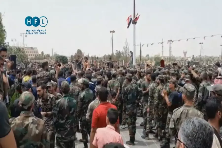 تحت علم النظام.. هتافات وشعارات ضد نظام الأسد وإيران في درعا