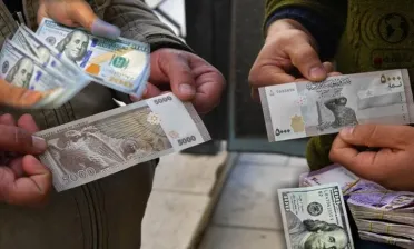 الذهب والليرة السورية في الديون: جدلية السداد بين النص القانوني والواقع الاقتصادي